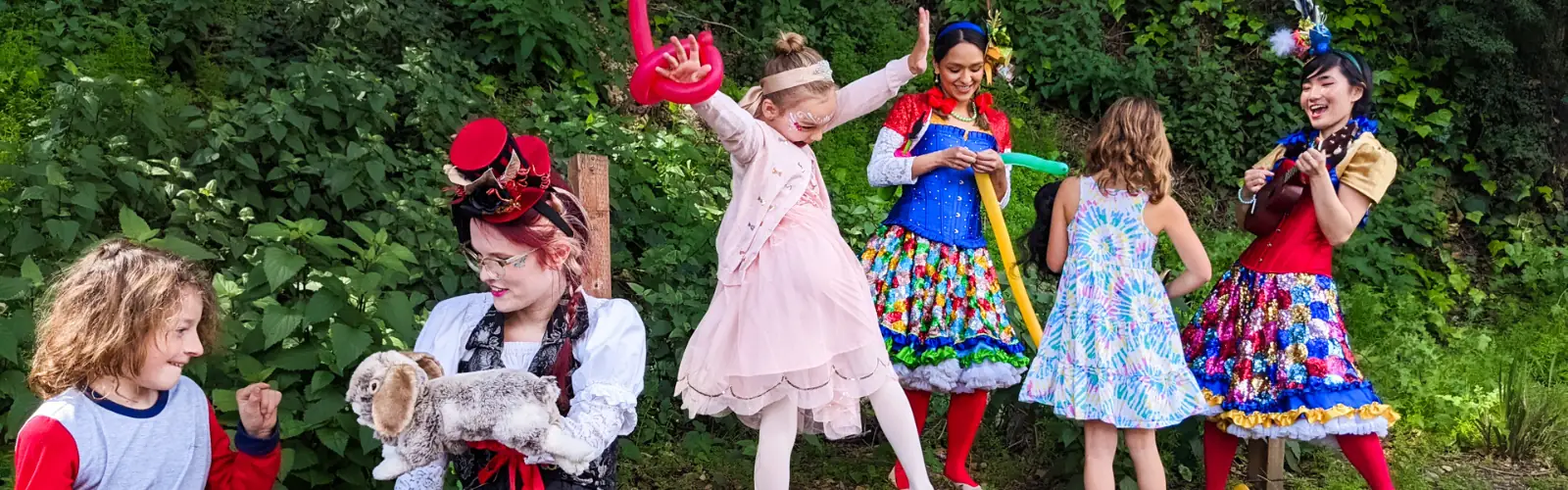 Costumed performers entertaining children at a recurring community event series.