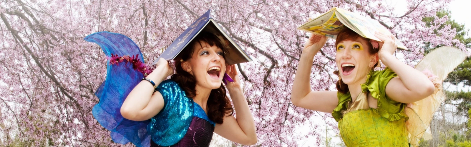 Costumed performers bringing a reading theme to life for children at a library.