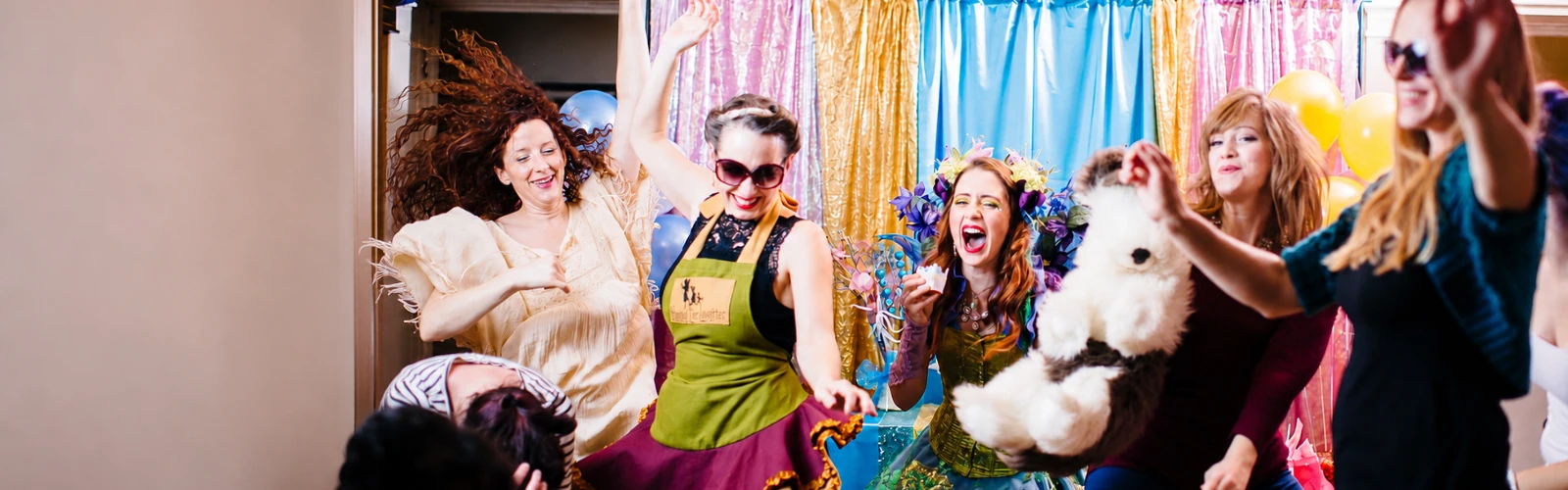 Costumed performers entertaining children at a private party.