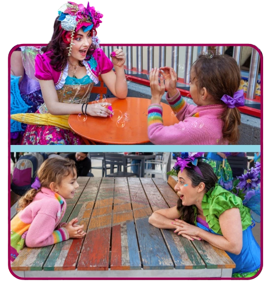 Children gathered around a face painting and play table at an outdoor party.