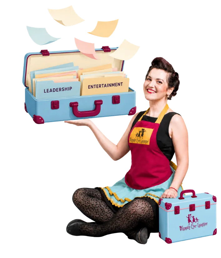 A Happily Ever Laughter faerie holding an open blue suitcase, with labeled Leadership and Entertainment folders and papers floating out.